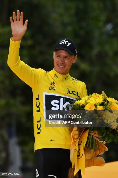 Tour de France 2017's winner Great Britain's Christopher Froome celebrates his overall leader yellow jersey on the podium at the end of the 103 km...