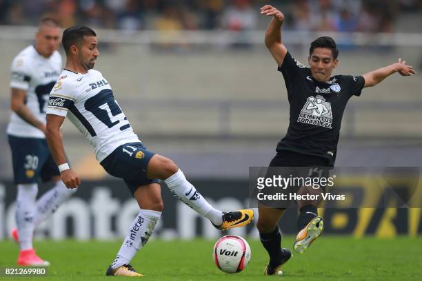 Bryan Rabello of Pumas struggles for the ball with Erick Aguirre of Pachuca during the 1st round match between Pumas UNAM and Pachuca as part of the...