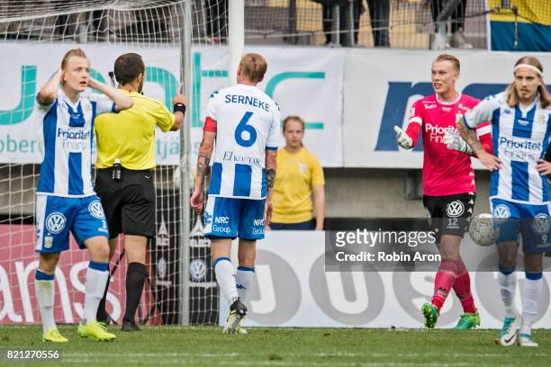 Pontus Dahlberg, goalkeeper of IFK Goteborg upset on referee Kaspar Sjoberg who just judge penalty kick, and dejected Scott Jamieson of IFK Goteborg...