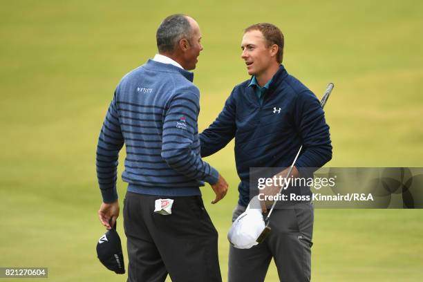 Jordan Spieth of the United States is congratulated by Matt Kuchar of the United States on the 18th green during the final round of the 146th Open...