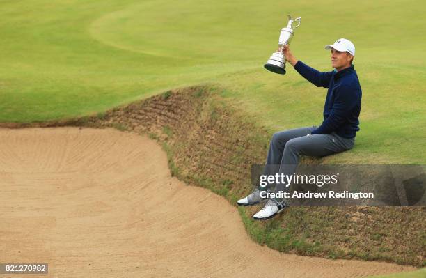 Jordan Spieth of the United States celebrates victory as he poses with the Claret Jug on the 18th green during the final round of the 146th Open...