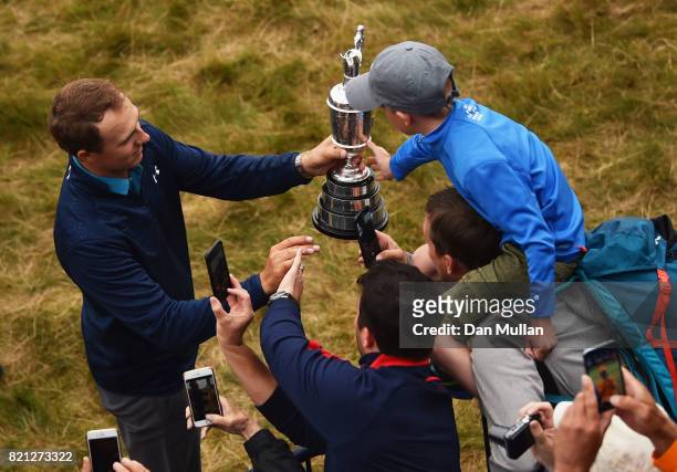 Jordan Spieth of the United States celebrates victory as he walks with the Claret Jug around the 18th green during the final round of the 146th Open...