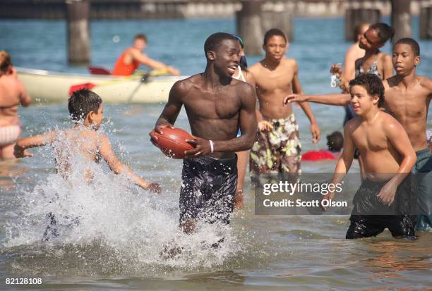 Beach goers play in the water at North Avenue Beach July 30, 2008 in Chicago, Illinois. According to the National Resources Defense Council beaches...