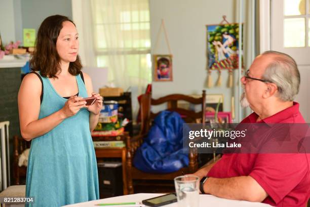 MoveOn.org members practice script at the Neighborhood Listening Project Healthcare Door Knocking Canvass Event on July 23, 2017 in Ardmore,...