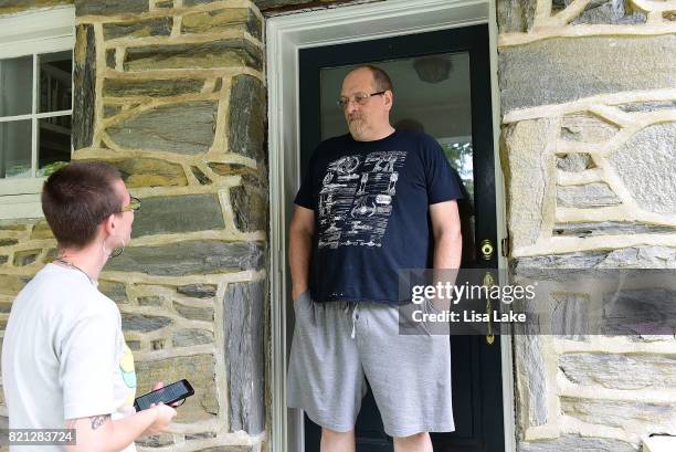 MoveOn.org member talks with neighbor during the Neighborhood Listening Project Healthcare Door Knocking Canvass Event on July 23, 2017 in Ardmore,...