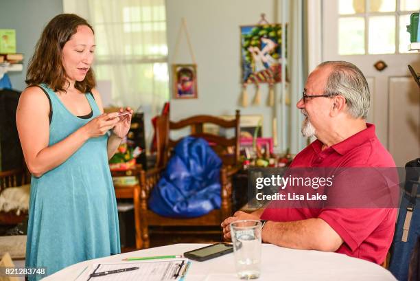 MoveOn.org members practice script at the Neighborhood Listening Project Healthcare Door Knocking Canvass Event on July 23, 2017 in Ardmore,...