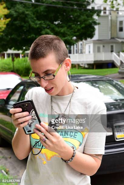 MoveOn.org member types in responses during the Neighborhood Listening Project Healthcare Door Knocking Canvass Event on July 23, 2017 in Ardmore,...