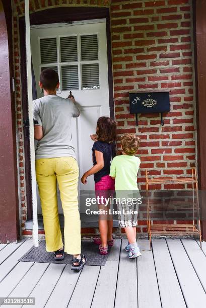 MoveOn.org member walks door to door during the Neighborhood Listening Project Healthcare Door Knocking Canvass Event on July 23, 2017 in Ardmore,...