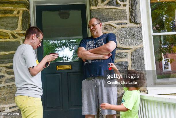 MoveOn.org member talks with neighbor during the Neighborhood Listening Project Healthcare Door Knocking Canvass Event on July 23, 2017 in Ardmore,...