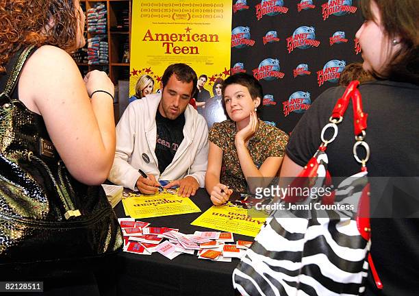 Colin Clemens and Hannah Bailey of the documentary "American Teen" sign autographs at Planet Hollywood in Times Square on July 25, 2008 in New York...