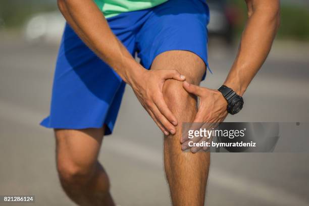 jogging injury - human knee stock pictures, royalty-free photos & images