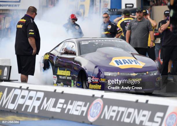 Prod stick driver Vincent Noble during his burnout at the line on his second run of the day at the 38th annual NHRA Mopar Mile High Nationals at...