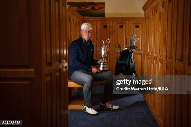 Jordan Spieth of the United States holds the Claret Jug in the locker room after winning the 146th Open Championship at Royal Birkdale on July 23,...