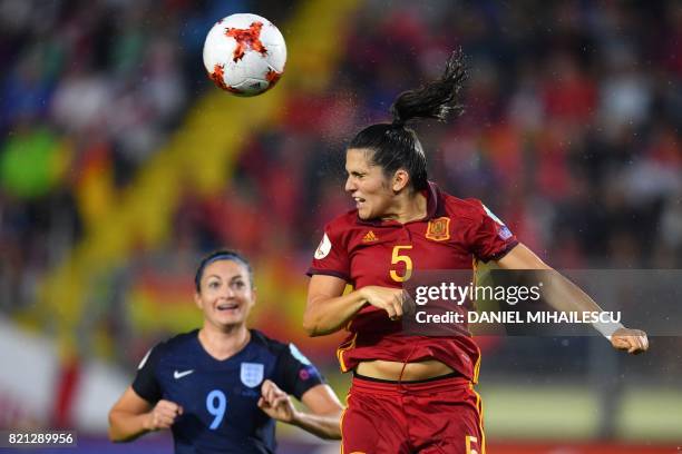 Spain's defender Andrea Pereira head the ball as England's forward Jodie Taylor eyes it during the UEFA Womens Euro 2017 football tournament match...