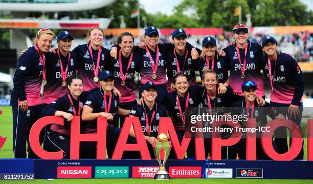 The England side pose with the trophy during the ICC Women's World Cup 2017 Final between England and India at Lord's Cricket Ground on July 23, 2017...