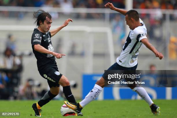 Brian Figueroa of Pumas struggles for the ball with Joaquin Martinez of Pachuca during the 1st round match between Pumas UNAM and Pachuca as part of...