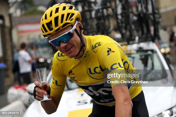 Christopher Froome of Great Britain riding for Team Sky in the yellow leader's jersey celebrates his fourth General Classification overall victory...