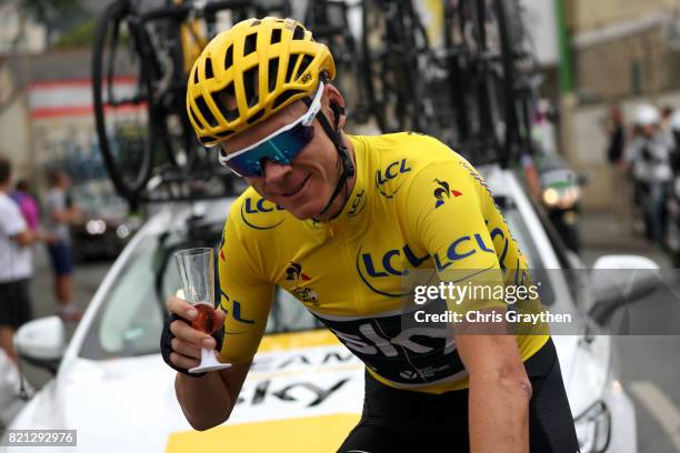 Christopher Froome of Great Britain riding for Team Sky in the yellow leader's jersey celebrates his fourth General Classification overall victory...