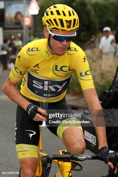 Christopher Froome of Great Britain riding for Team Sky in the yellow leader's jersey celebrates his fourth General Classification overall victory...