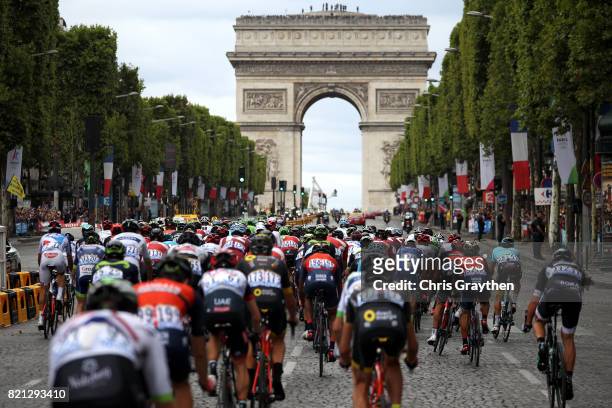 The peloton rides down the Champs-Elysees towards the Arc de Triomphe during stage 21 of the 2017 Le Tour de France, a 103km stage from Montgreon to...