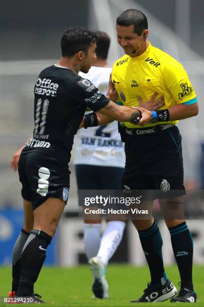 Edson Puch of Pachuca argues with the referee Diego Montaño during the 1st round match between Pumas UNAM and Pachuca as part of the Torneo Apertura...