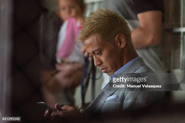Keisuke Honda of Pachuca looks at his phone prior the 1st round match between Pumas UNAM and Pachuca as part of the Torneo Apertura 2017 Liga MX at...