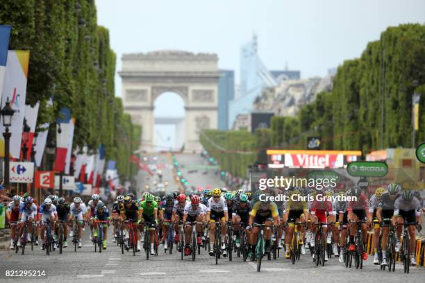 The peloton rides down the Champs-Elysees towards the Arc de Triomphe during stage 21 of the 2017 Le Tour de France, a 103km stage from Montgreon to...