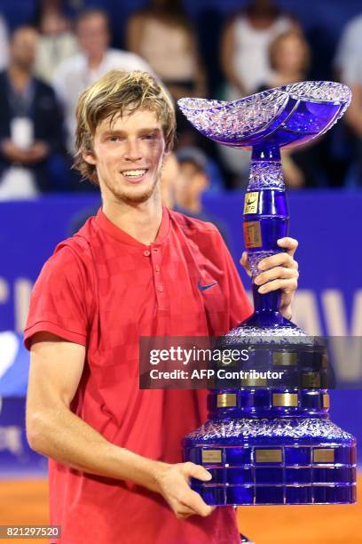 Winner Russian tennis player Andrey Rublev poses with his trophy during the prize ceremony after competing in the ATP Croatia Open tennis tournament...