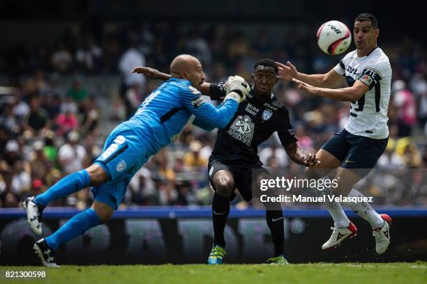 Oscar Perez goalkeeper of Pachuca fights for the ball with Gerardo Alcoba of Pumas during the 1st round match between Pumas UNAM and Pachuca as part...