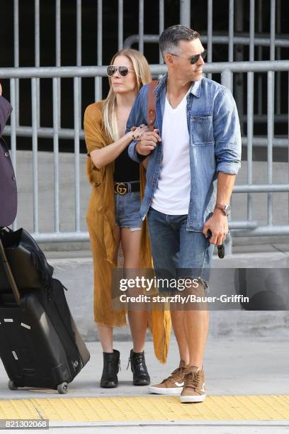 LeAnn Rimes and Eddie Cibrian are seen at LAX on July 23, 2017 in Los Angeles, California.