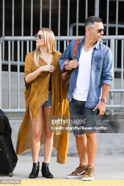 LeAnn Rimes and Eddie Cibrian are seen at LAX on July 23, 2017 in Los Angeles, California.