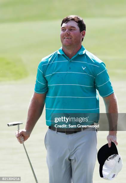 Grayson Murray of the United States celebrates after winning on the 18th green during the final round of the Barbasol Championship at the Robert...