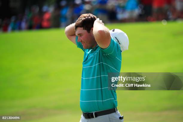 Grayson Murray of the United States celebrates after winning on the 18th green during the final round of the Barbasol Championship at the Robert...