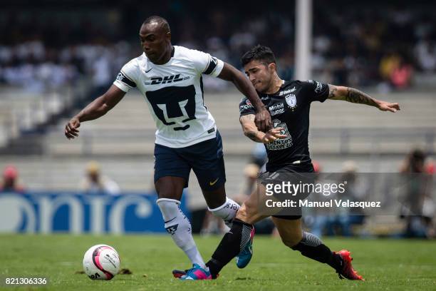 Joffre Guerron of Pumas struggles for the ball with Jonathan Urretaviscaya of Pachuca during the 1st round match between Pumas UNAM and Pachuca as...