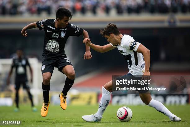 Pablo Lopez of Pachuca struggles for the ball against Jose Carlos Van Rankin of Pumas during the 1st round match between Pumas UNAM and Pachuca as...