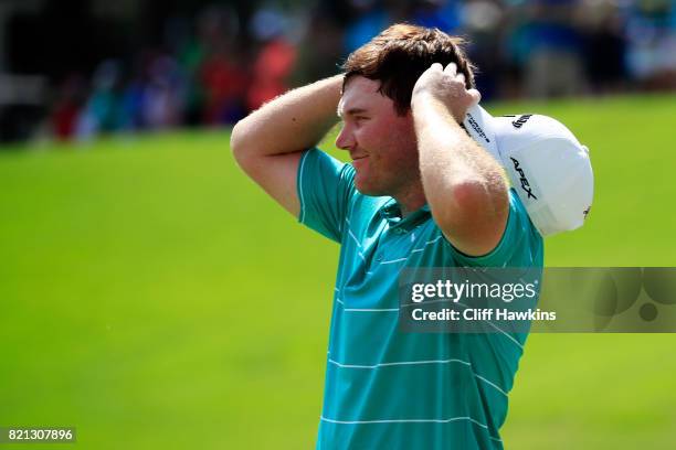 Grayson Murray of the United States celebrates after winning on the 18th green during the final round of the Barbasol Championship at the Robert...
