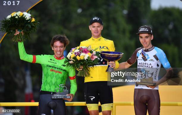 Team Sky rider Christopher Froome of Great Britain, Rigoberto Uran of Colombia and Romain Bardet of France celebrate on the podium after winning the...