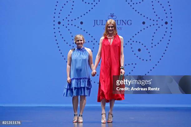 Designer Julia Jung acknowledges the applause of the audience after her show together with model Veit Alex at the Fashionyard show during Platform...