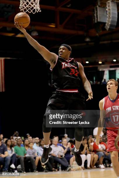 Rashad McCants of Trilogy attempts a shot past Lou Amundson of Tri-State during week five of the BIG3 three on three basketball league at UIC...