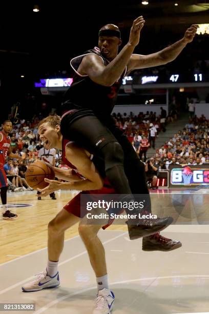 Lou Amundson of Tri-State and Al Harrington of Trilogy collide during week five of the BIG3 three on three basketball league at UIC Pavilion on July...