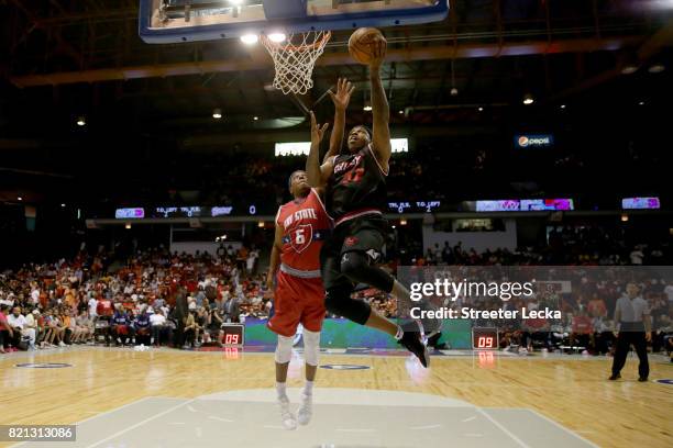 Rashad McCants of Trilogy attempts a shot while being guarded by Bonzi Wells of Tri-State during week five of the BIG3 three on three basketball...