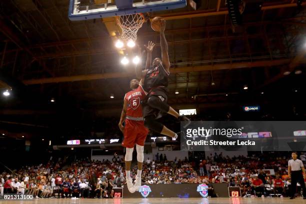 Rashad McCants of Trilogy attempts a shot while being guarded by Bonzi Wells of Tri-State during week five of the BIG3 three on three basketball...