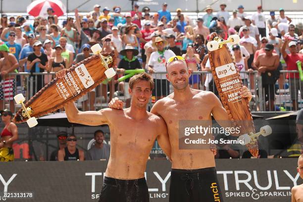 Taylor Crab and Jake Gibb pose with the winners trophy after the men's final of the AVP Hermosa Beach Open on July 23, 2017 in Hermosa Beach,...