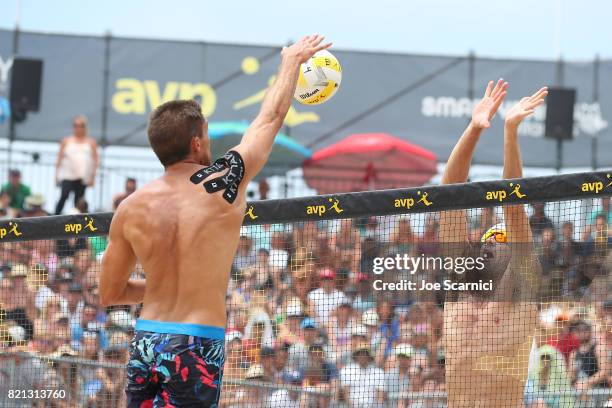 Trevor Crabb spikes the ball over Jake Gibb during the men's final of the AVP Hermosa Beach Open on July 23, 2017 in Hermosa Beach, California.