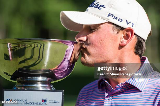 Hank Lebioda kisses the trophy after becoming the Mackenzie Investments Open champion during the final round at Club de Golf Les Quatre Domaines on...