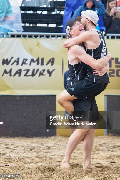 Markus Bockermann and Lars Fluggen of Germany celebate their victory in the men's final during FIVB Grand Tour - Olsztyn: Day 5 on July 23, 2017 in...