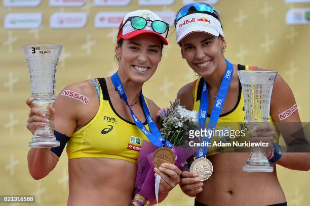 Agatha Bednarczuk and Eduarda "Duda" Lisboa of Brazil, bronze medal winners at the Warmia Mazury Olsztyn Open, pose with their medals at the awarding...