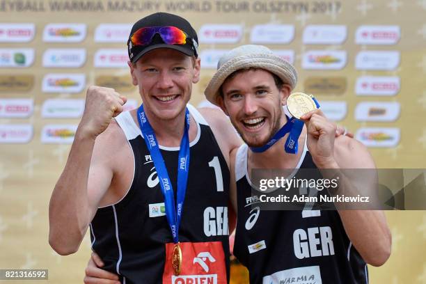 Gold medal winners Markus Bockermann and Lars Fluggen of Germany pose with their medals during the awarding ceremony of the FIVB Grand Tour -...