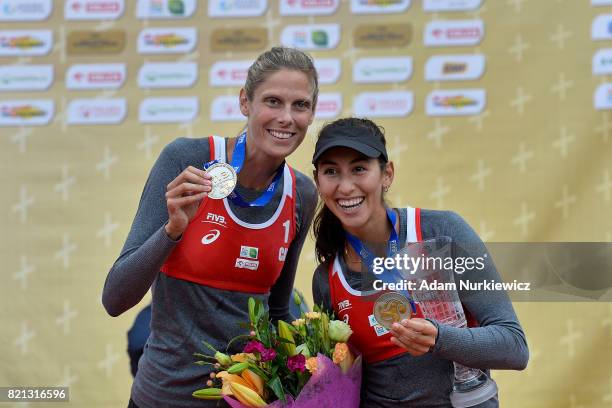 Sarah Pavan and Melissa Humana-Paredes of Canada, silver medal winners at the Warmia Mazury Olsztyn Open pose with their medals during the awarding...