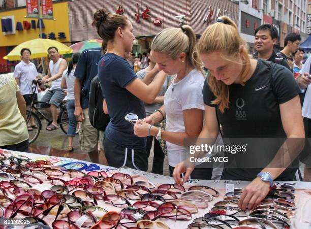 Members of the USA women's soccer team, Lauren Cheney, Heather Mitts and Rachel Buehler go shopping on July 31, 2008 in the commercial pedestrian...